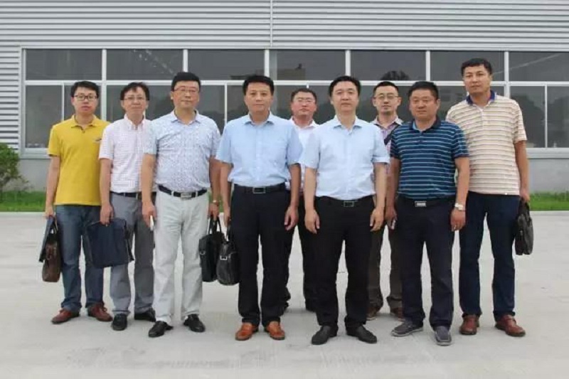Customer visit group photo outside factory